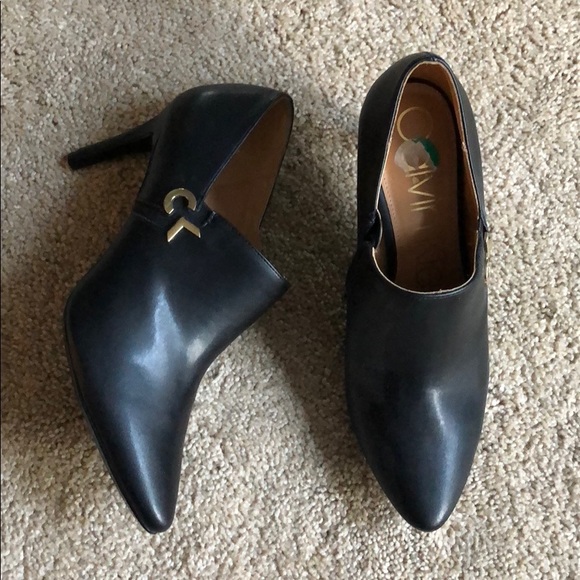 black dress shoes with gold accents